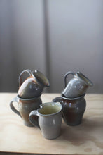 Load image into Gallery viewer, Soda Fired Altered Thumb Mug
